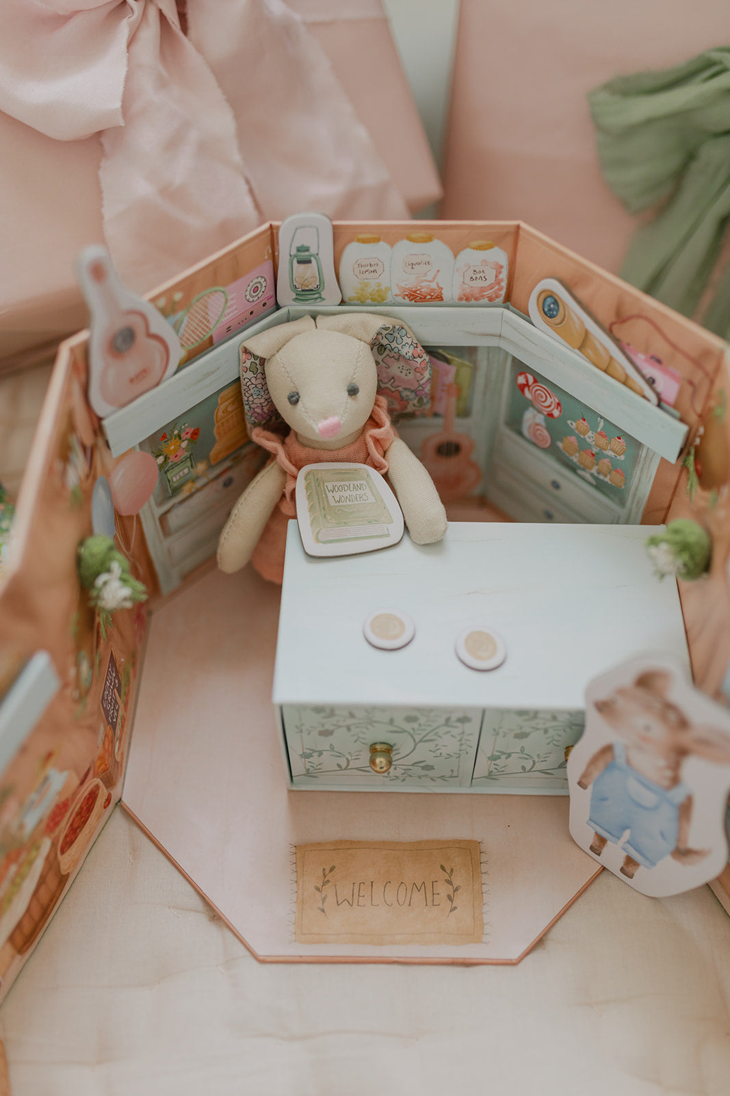 Betsy Bunny inside her little tree stump shop. Beautifully illustrated playset.