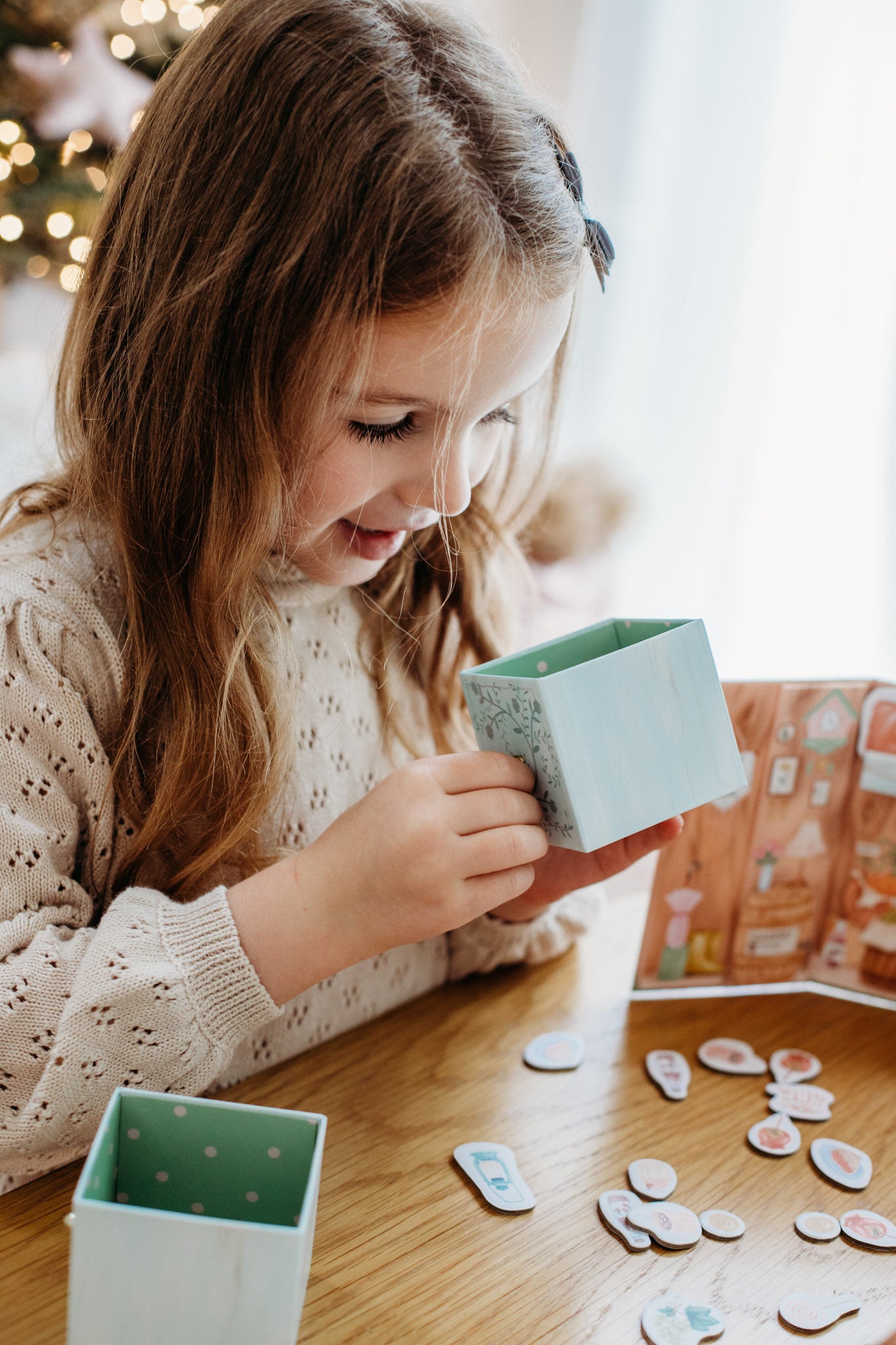 A girl playing with the music box hidden inside this beautiful play set. A great present for girls aged 3 plus.