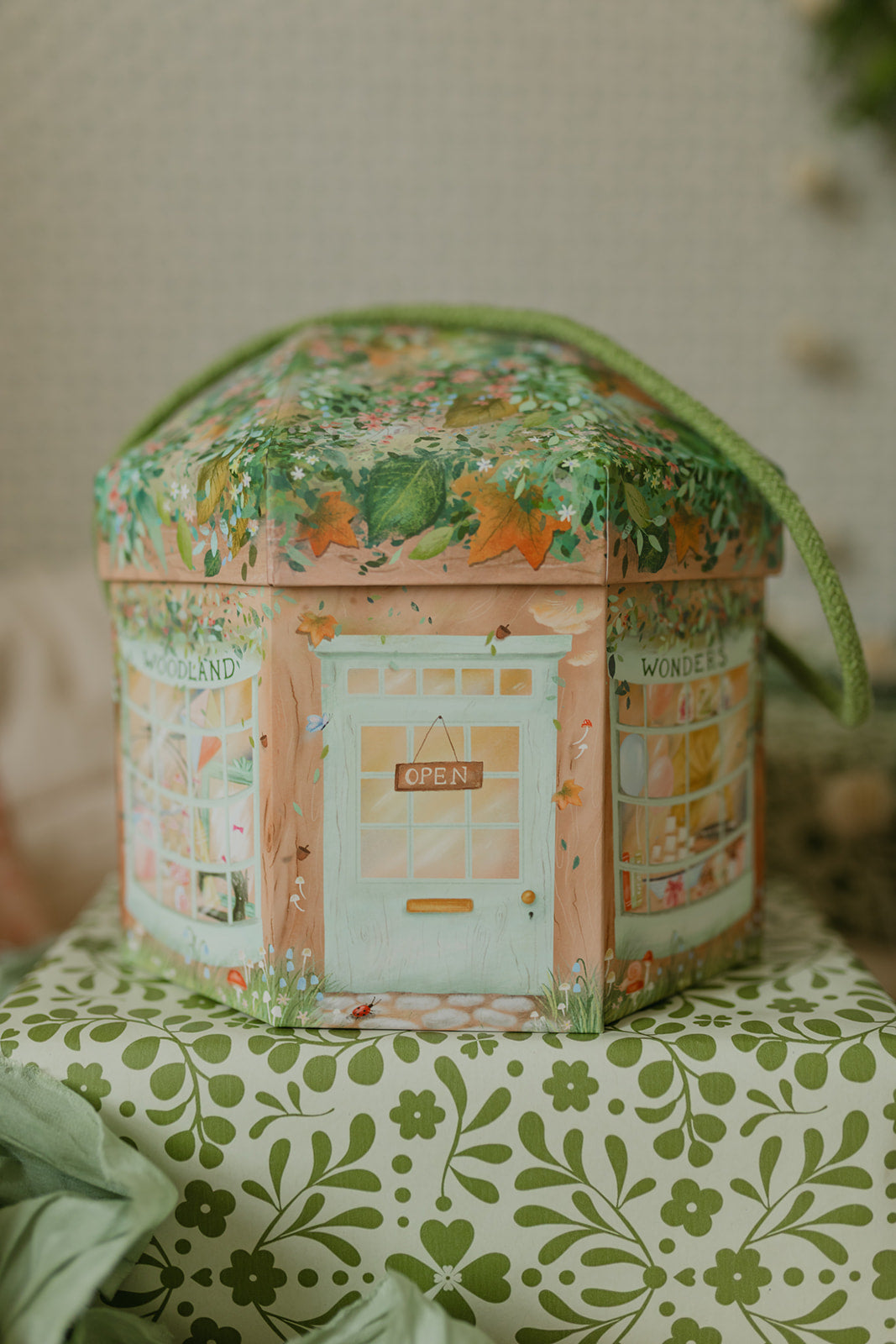 Decorative hexagonal play set with a whimsical design on a patterned surface.