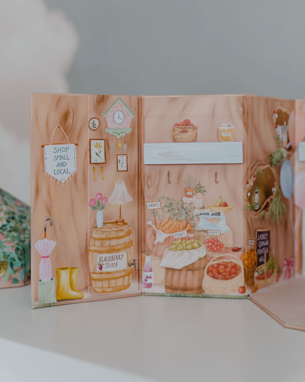 This toy set is beautifully illustrated with all of the items for sale in Betsy's shop.